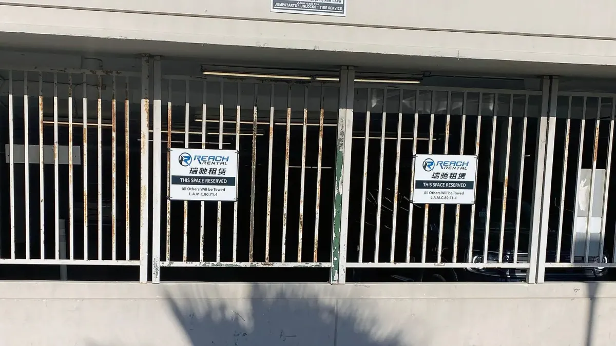 Reach Rental reserved-parking sign