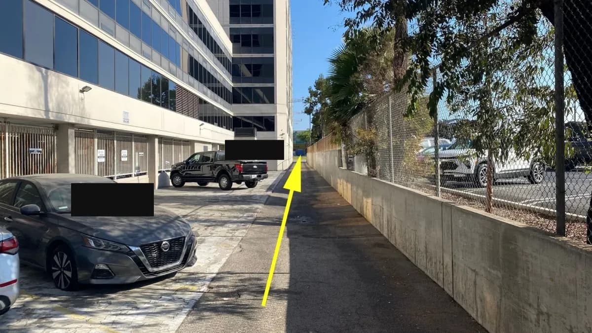 Drive straight down the alley and exit onto Century Blvd