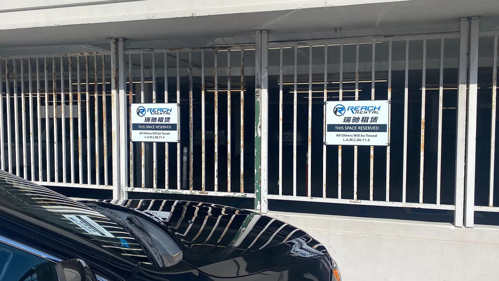 Reach Rental designated parking signs