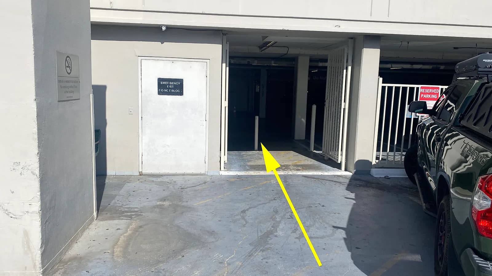 Walking from the side parking area toward the indoor entrance