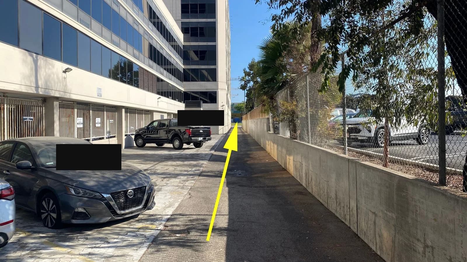 Drive straight down the alley and exit onto Century Blvd